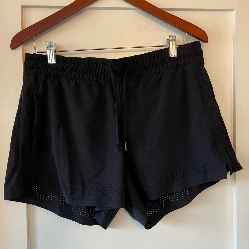 Athleta black shorts with laser cut detail